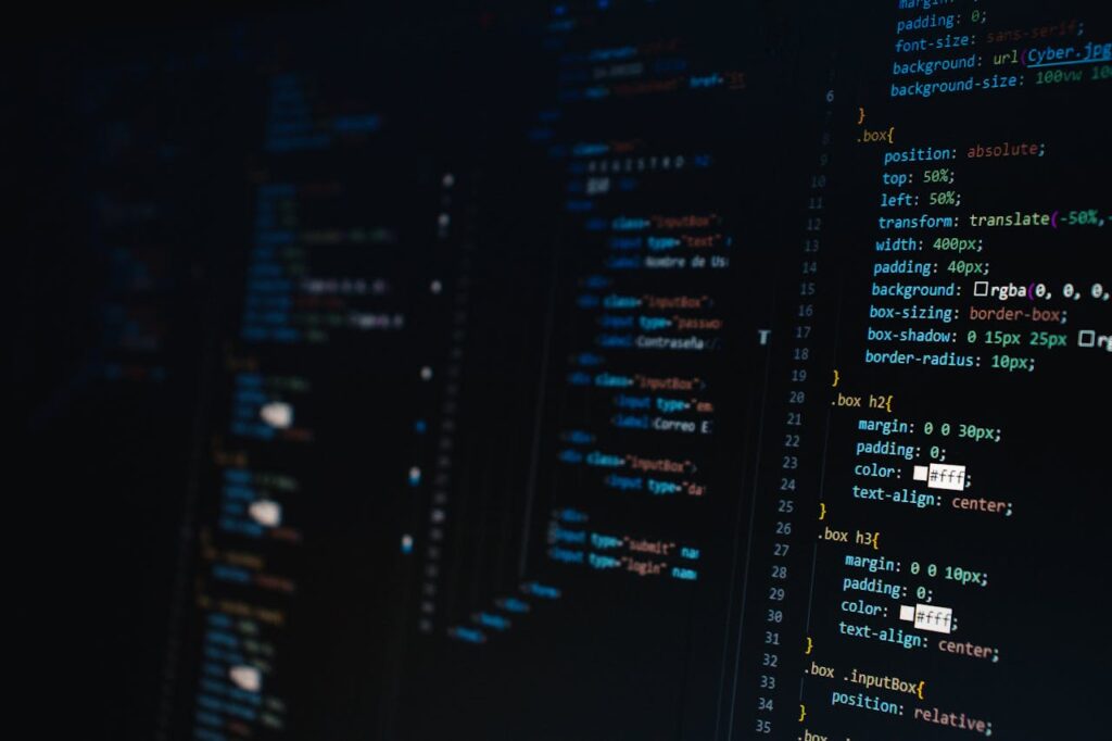 Detailed view of HTML and CSS code on a dark screen, representing modern web development.